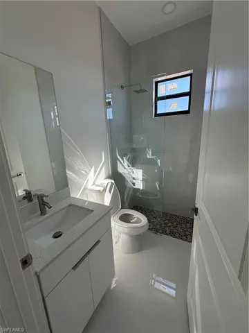 Bathroom with vanity and a walk in shower