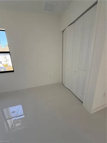 Unfurnished bedroom featuring a closet