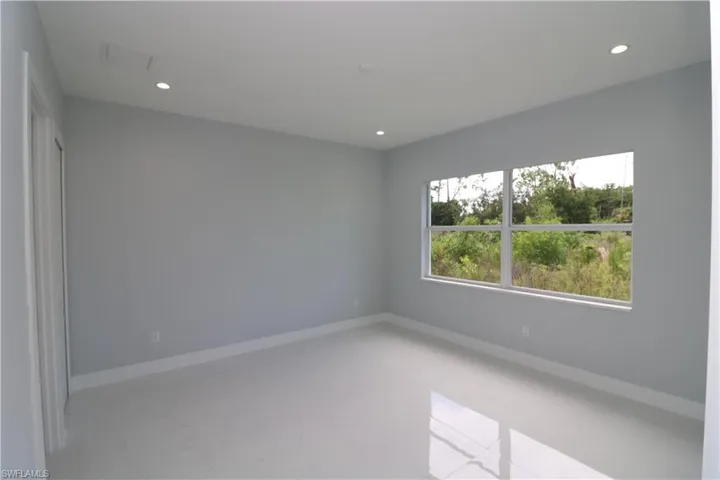 Unfurnished room with concrete flooring