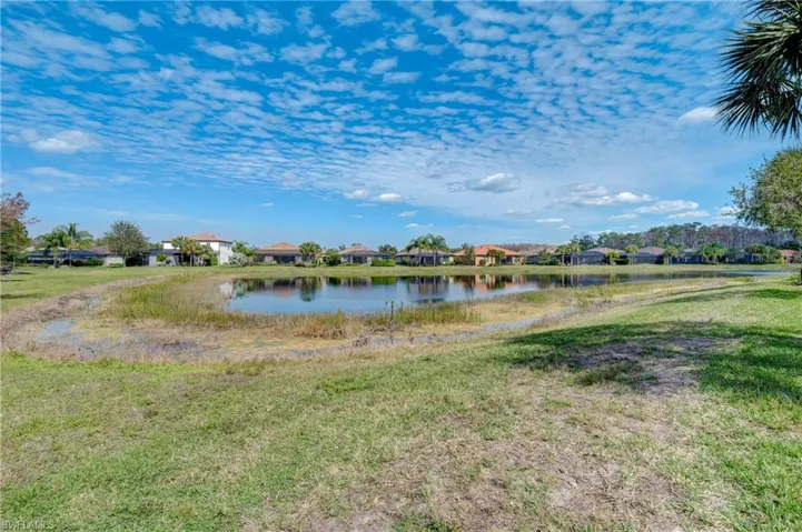 this home has view of preserve and corner view of pond.