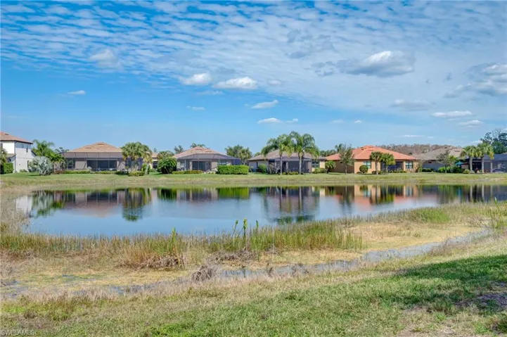 this home has view of preserve and corner view of pond.