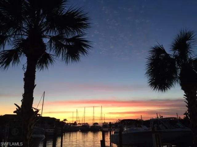 Property view of water featuring a boat dock