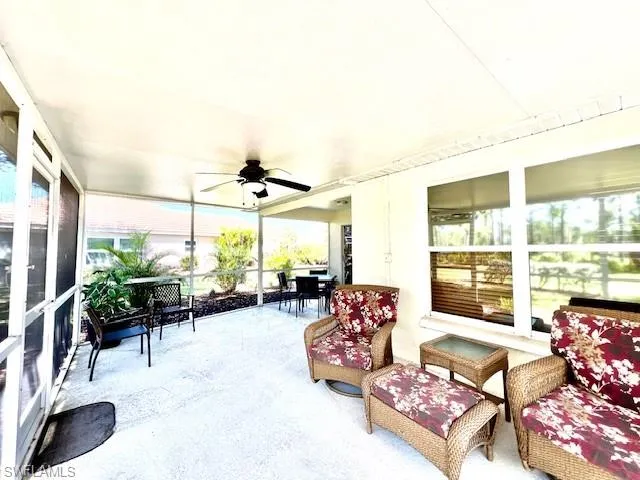 Sunroom / solarium featuring ceiling fan