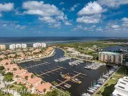 Birds eye view of property with a water view