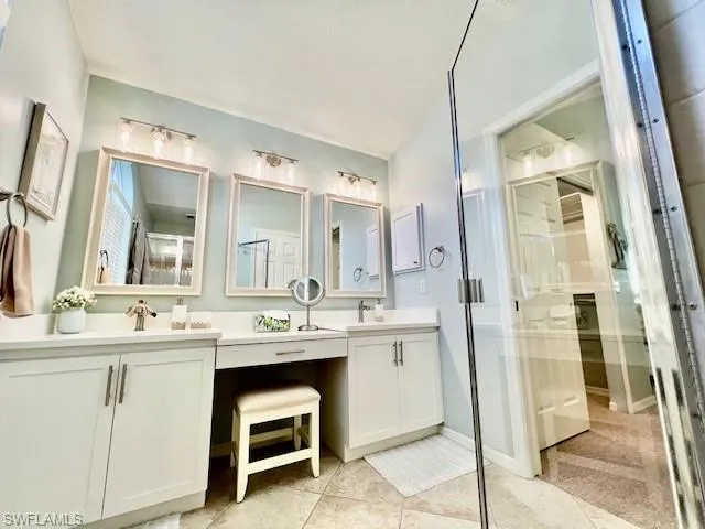 Bathroom featuring vanity and tile patterned flooring