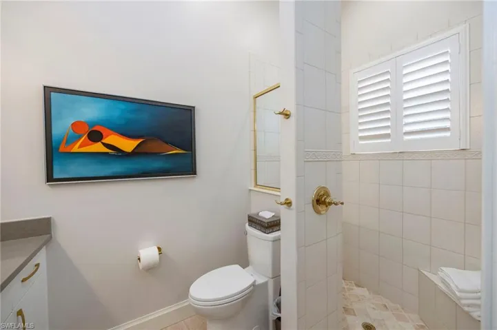 Bathroom with walk in shower and vanity