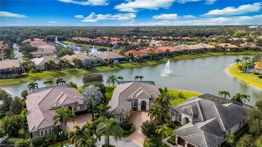 Aerial view of residential area featuring a large body of water