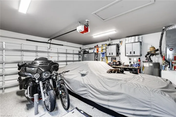 Garage with a garage door opener and water heater