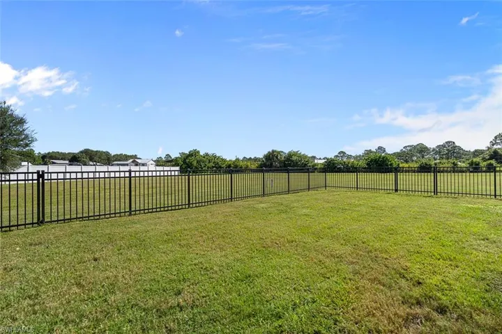 View of fenced backyard
