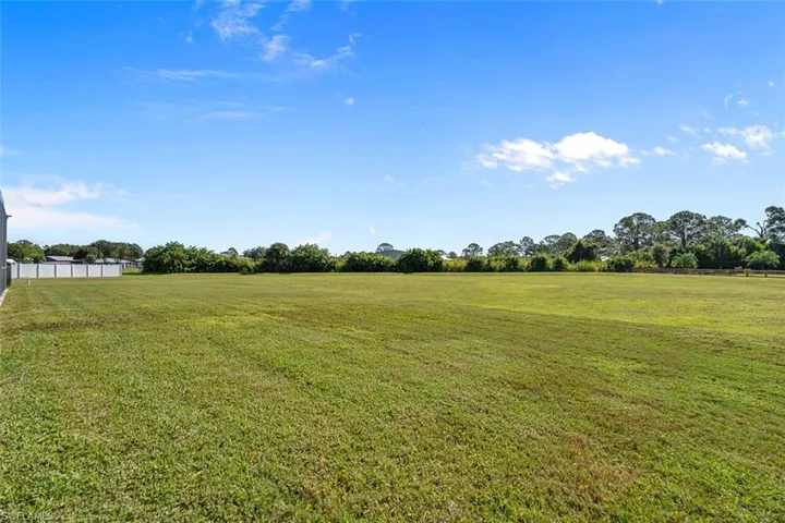 View of yard with a rural view