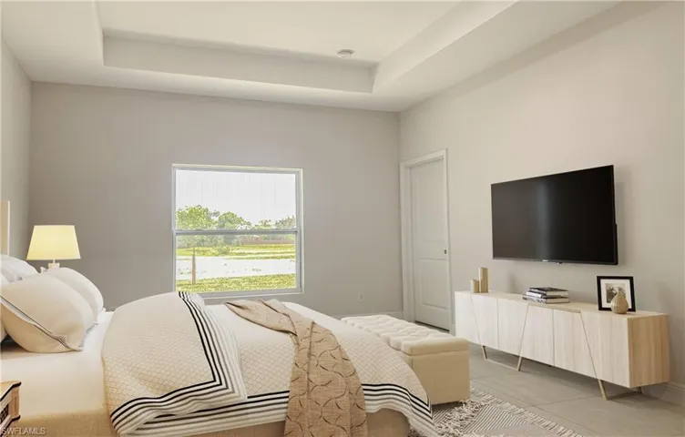 Tiled bedroom with a tray ceiling