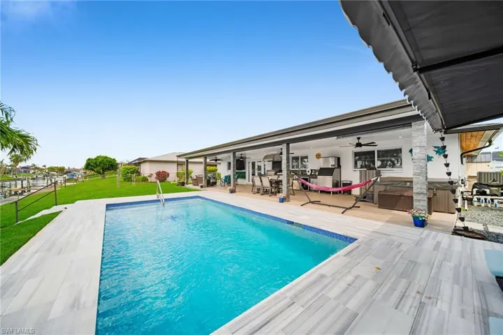 Outdoor pool with a yard