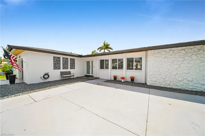 Back of house with stucco siding
