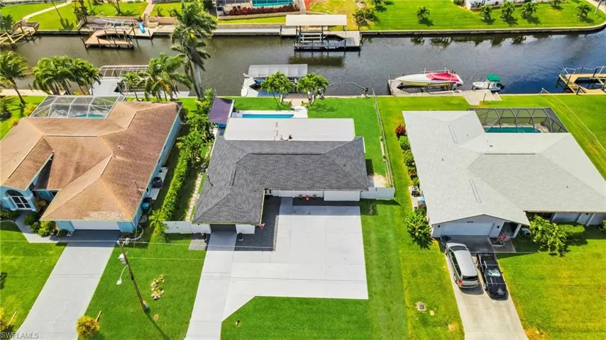 Aerial view featuring a water view and a residential view