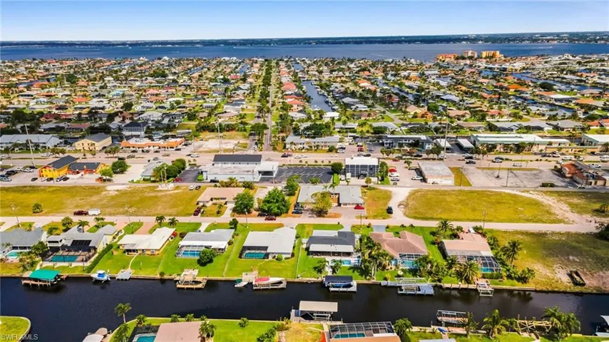 Aerial view featuring a water view and a residential view
