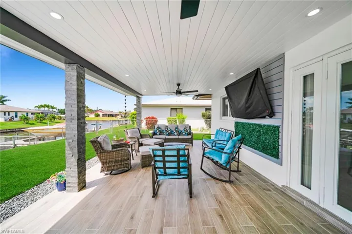 View of patio featuring outdoor lounge area and a ceiling fan