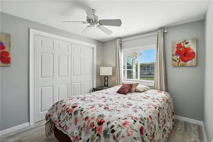 Guest Room featuring wood finished floors, a closet, and a ceiling fan
