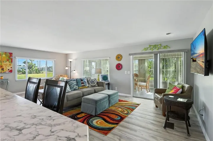 Living/Family Room with light wood-type flooring and baseboards