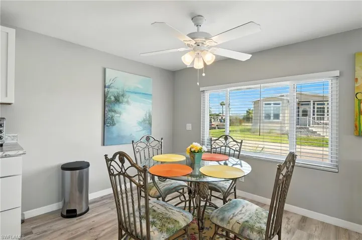 Dining space featuring light wood-style flooring and ceiling fan