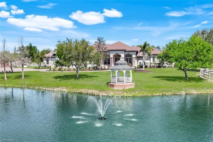 Lake with fountain and gazebo.