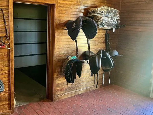 Tack room which opens to feed room.