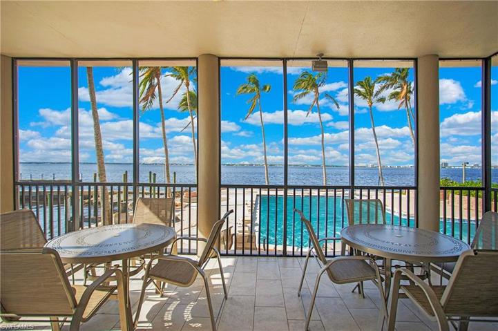 The Clubhouse Lanai overlooks the Resort Style Pool with endless water views...end the day with a sunset and tropical breeze!