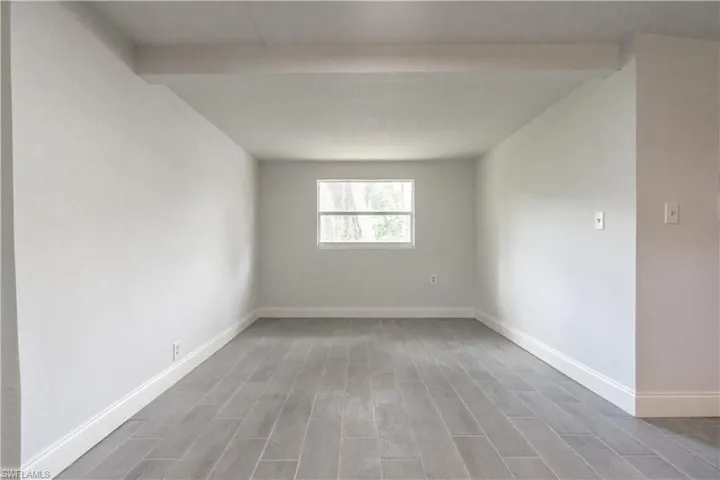 Unfurnished room with hardwood / wood-style flooring