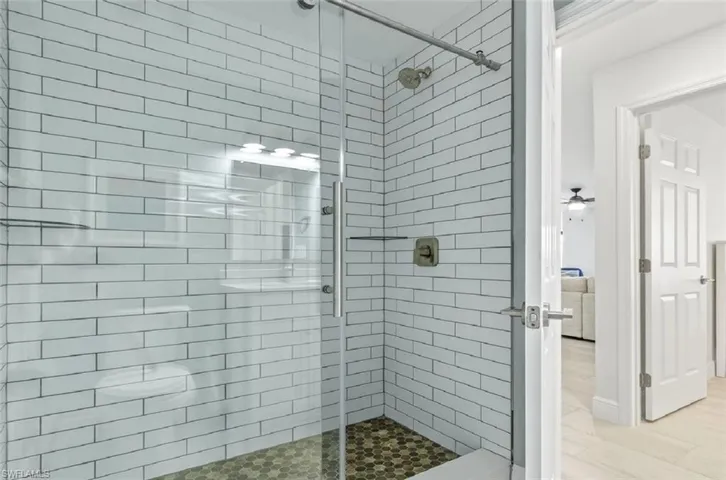 Bathroom featuring a shower stall