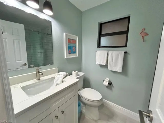 Bathroom with vanity and a shower