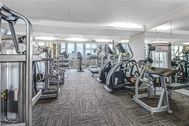Workout area featuring dark carpet
