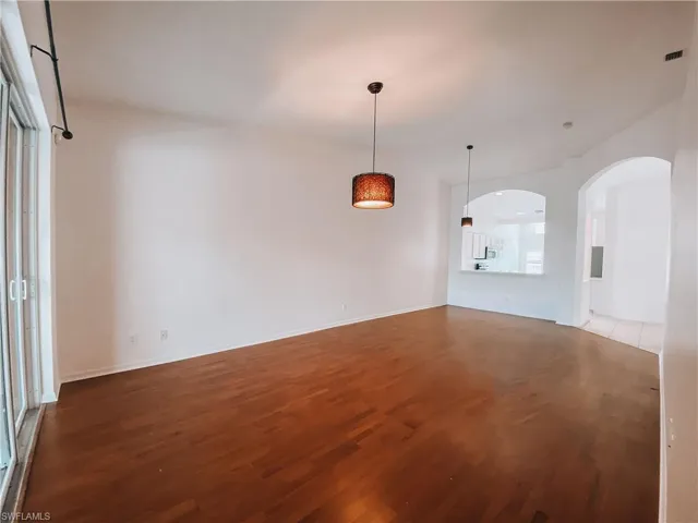 Unfurnished room featuring hardwood / wood-style floors