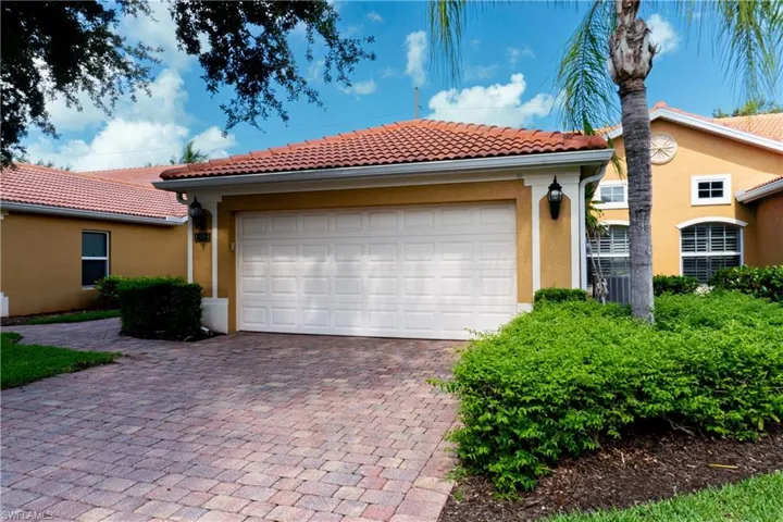 View of front facade featuring a garage
