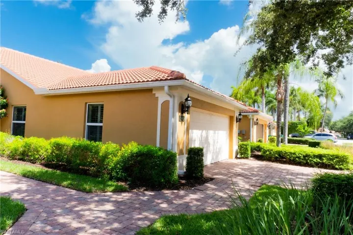 View of side of property featuring a garage
