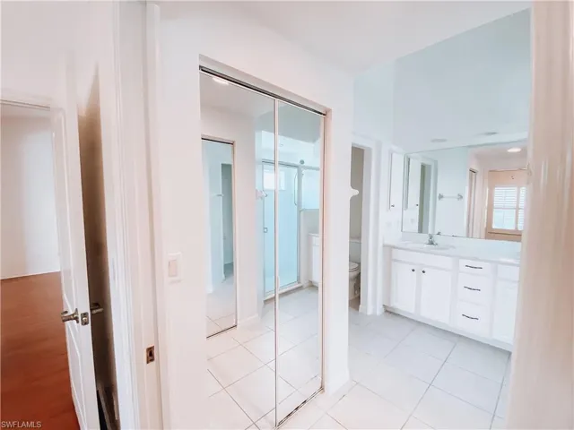 Bathroom with vanity, toilet, and hardwood / wood-style floors