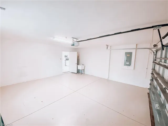 Garage featuring sink and a garage door opener