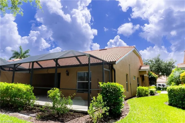 Back of house with glass enclosure