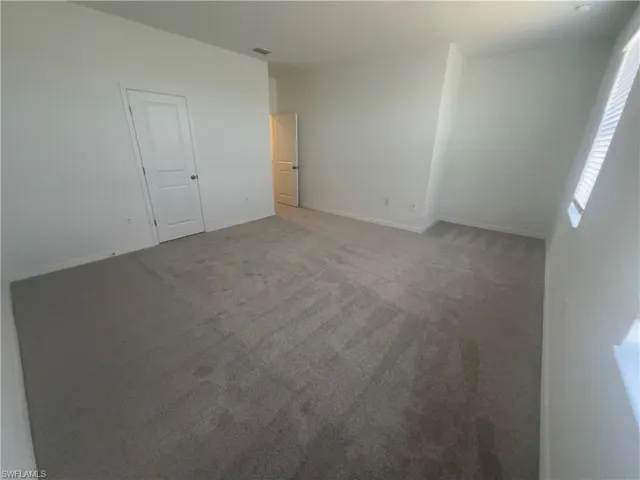 Unfurnished room featuring carpet floors