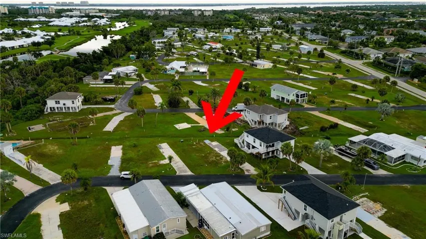 Aerial overview of property's location featuring nearby suburban area
