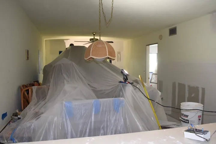 VIEW FROM KITCHEN INTO LIVING AREA.  ENTRANCE AT MIDDLE RIGHT IS TO OWNER'S SUITE.