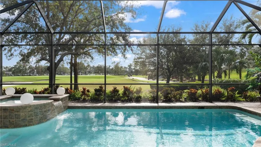 View of swimming pool with a lanai