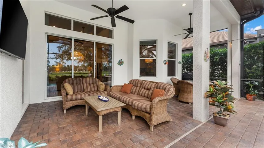 View of patio with ceiling fan and an outdoor hangout area