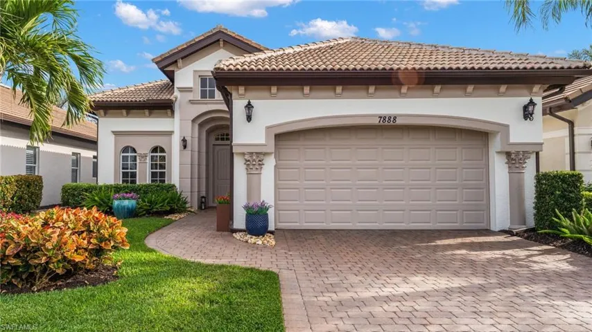 Mediterranean / spanish home with a garage