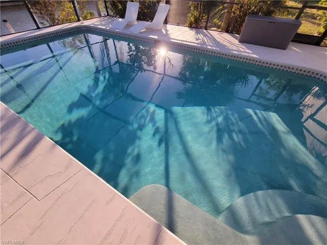 View of pool featuring a lanai
