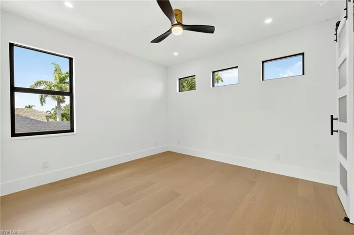 front upstairs bedroom, above garage