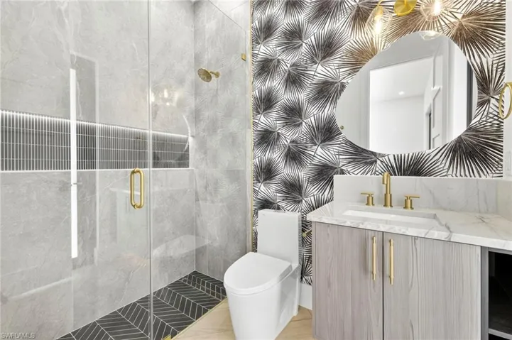 Full bath featuring vanity and a stall shower