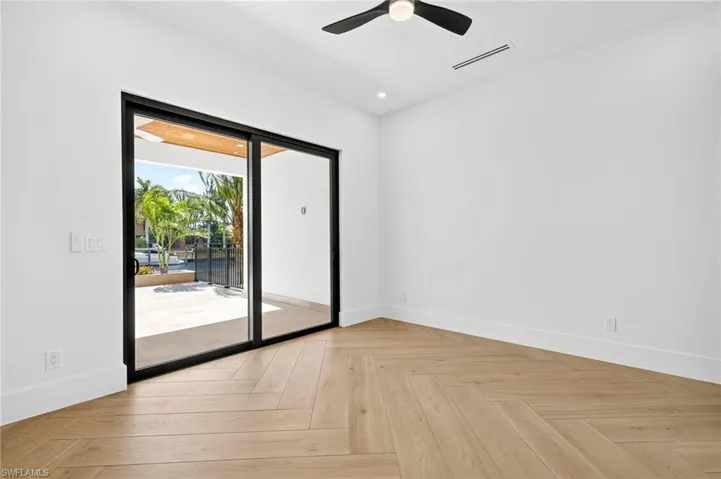 Empty room with baseboards and recessed lighting