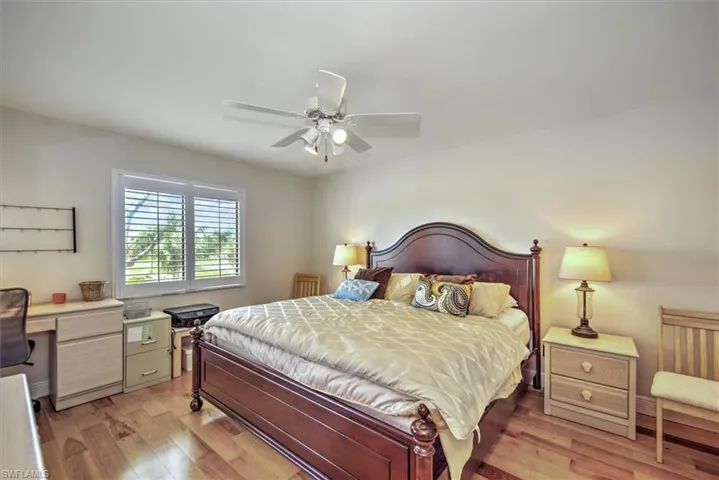 Bedroom with light wood-type flooring and ceiling fan