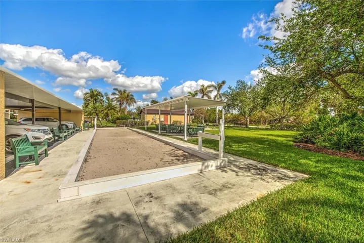 View of property's community featuring a yard