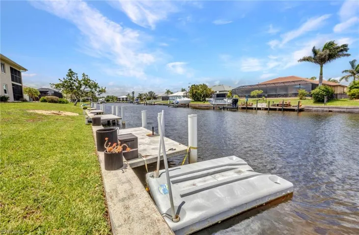 Concrete dock with updated pilings and permitted floating jet ski dock.