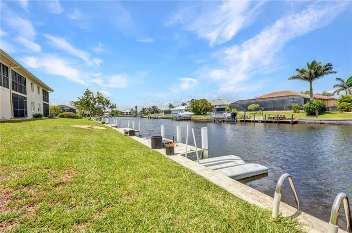 Dock with a yard, 240 feet on the water and a residential view